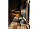Charming walkway along the side of the house with garden bed with accent rocks and small plants, lit by decorative string lights at 2139 Cedarbrook Se Ct, Atlanta, GA 30316
