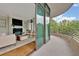 Private balcony with glass doors and treetop views at 750 Park Ne Ave # 6E, Atlanta, GA 30326