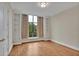 Bright bedroom with hardwood floors, built-in shelves, and large window at 750 Park Ne Ave # 6E, Atlanta, GA 30326