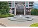 Luxury building entrance with fountain at 750 Park Ne Ave # 6E, Atlanta, GA 30326
