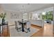 Elegant dining room features a dark wood table and gray chairs, with hardwood floors and an open floor plan at 750 Park Ne Ave # 6E, Atlanta, GA 30326