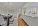 Modern white kitchen with granite counters and stainless steel appliances at 750 Park Ne Ave # 6E, Atlanta, GA 30326