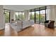 Modern living room with hardwood floors and large windows at 750 Park Ne Ave # 6E, Atlanta, GA 30326