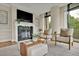 Bright living room with fireplace and large windows at 750 Park Ne Ave # 6E, Atlanta, GA 30326