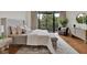 Bright main bedroom with hardwood floors, a comfy bed and plenty of natural light at 750 Park Ne Ave # 6E, Atlanta, GA 30326