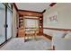 Home office with built-in shelving and hardwood floors at 750 Park Ne Ave # 6E, Atlanta, GA 30326