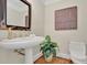 Stylish powder room with pedestal sink and hardwood floors at 750 Park Ne Ave # 6E, Atlanta, GA 30326