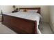 Large bedroom with wooden sleigh bed and carpet at 4414 Parmalee Path, Conley, GA 30288