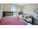 Bedroom with two twin beds and window at 4414 Parmalee Path, Conley, GA 30288