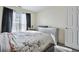 Bright bedroom with window and gray dresser at 4414 Parmalee Path, Conley, GA 30288