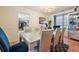 Elegant dining room with a silver table and blue chairs at 4414 Parmalee Path, Conley, GA 30288