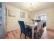 Spacious dining room with chandelier and hardwood floors at 4414 Parmalee Path, Conley, GA 30288