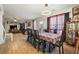 Dining room with a large table, chairs, and a view of the living room at 4414 Parmalee Path, Conley, GA 30288