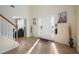 Bright and spacious entryway with hardwood floors and a view into the living room at 4414 Parmalee Path, Conley, GA 30288