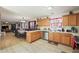 Open concept kitchen with island, stainless steel appliances, and hardwood floors at 4414 Parmalee Path, Conley, GA 30288