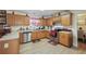 Spacious kitchen with stainless steel appliances and light wood cabinets at 4414 Parmalee Path, Conley, GA 30288