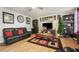 Living room featuring leather couches, a large TV, and decorative accents at 4414 Parmalee Path, Conley, GA 30288