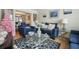 Cozy living room with blue couches, a glass coffee table, and decorative accents at 4414 Parmalee Path, Conley, GA 30288