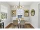 Charming dining room with glass table and modern art at 1195 Barnes Nw St, Atlanta, GA 30318