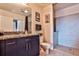 Bathroom with granite vanity, tiled shower, and toilet at 250 Pharr Rd # 712, Atlanta, GA 30305