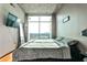 Spacious bedroom with hardwood floors, large windows, and city views at 250 Pharr Rd # 712, Atlanta, GA 30305
