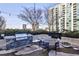 Outdoor grilling area with table and chairs at 250 Pharr Rd # 712, Atlanta, GA 30305