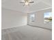 Bright and spacious bedroom with ceiling fan and carpeting at 441 Pine Way, Dallas, GA 30157