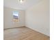 Simple bedroom with hardwood floors and a large window at 441 Pine Way, Dallas, GA 30157