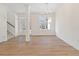 Bright dining room with hardwood floors and a large chandelier at 441 Pine Way, Dallas, GA 30157