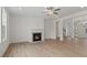 Open living space with hardwood floors, fireplace, and a view into the dining area at 441 Pine Way, Dallas, GA 30157