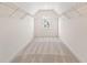 Large walk-in closet with wire shelving and window at 441 Pine Way, Dallas, GA 30157