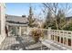 Back deck with ample space features white benches and is surrounded by a natural setting at 1324 Cambridge Ave, Atlanta, GA 30344