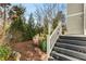 Landscaped backyard with privacy hedges and pine straw at 1324 Cambridge Ave, Atlanta, GA 30344