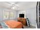 Cozy bedroom featuring a ceiling fan, natural light, and a dresser at 3160 New Macland Rd, Powder Springs, GA 30127