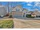 Two story house with gray siding, stone accents and a two car garage at 3230 Blackburn Dr, Cumming, GA 30040