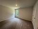 Spacious bedroom with carpet and large window at 5555 Bent Grass Way, Douglasville, GA 30135