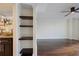 Bright living room with hardwood floors and built-in shelving at 2870 Pharr Court South Nw # 1205, Atlanta, GA 30305