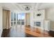 Bright living room with hardwood floors, fireplace, and city views at 2870 Pharr Court South Nw # 1205, Atlanta, GA 30305
