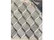 Grey and white geometric tile bathroom floor at 312 W Downing Ct, Jonesboro, GA 30238
