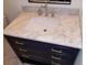 Bathroom vanity with marble countertop and gold accents at 312 W Downing Ct, Jonesboro, GA 30238