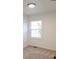 Charming bedroom with a large window and neutral walls at 312 W Downing Ct, Jonesboro, GA 30238