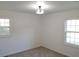 Well-lit bedroom featuring neutral walls and carpet at 312 W Downing Ct, Jonesboro, GA 30238