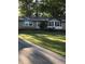 Brick ranch home with a spacious lawn and driveway at 312 W Downing Ct, Jonesboro, GA 30238
