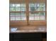 Modern kitchen sink with a gold faucet and large window at 312 W Downing Ct, Jonesboro, GA 30238