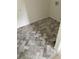Laundry Room with herringbone tile floor at 312 W Downing Ct, Jonesboro, GA 30238