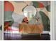 Stylish bar area with abstract wall art and wood cabinet at 120 Howard Se St, Atlanta, GA 30317
