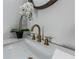 Modern bathroom sink with gold faucet and white countertop at 120 Howard Se St, Atlanta, GA 30317