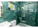 Modern bathroom with green tile and glass shower at 120 Howard Se St, Atlanta, GA 30317
