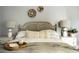Bright bedroom with cane headboard, neutral bedding, and stylish decor at 120 Howard Se St, Atlanta, GA 30317
