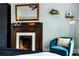 Bedroom with fireplace and teal accent chair at 120 Howard Se St, Atlanta, GA 30317